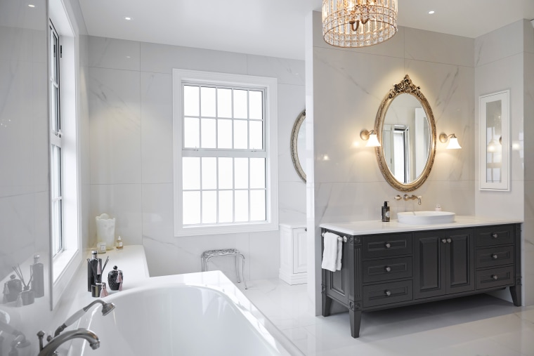 His and her vanities in this ensuite have architecture, bathroom, ensuite, bathroom accessory, bathroom cabinet, bathtub, floor, flooring, tiles, lighting, marble, sink, tap, tile, ingrid geldof design