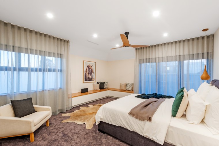The first floor features a large main bedroom bed, bed frame, bed sheet, bedding, bedroom, boutique hotel, building, ceiling, comfort, curtain, floor, furniture, house, interior design, mattress, mattress pad, property, real estate, room, suite, textile, wall, window covering, window treatment, white