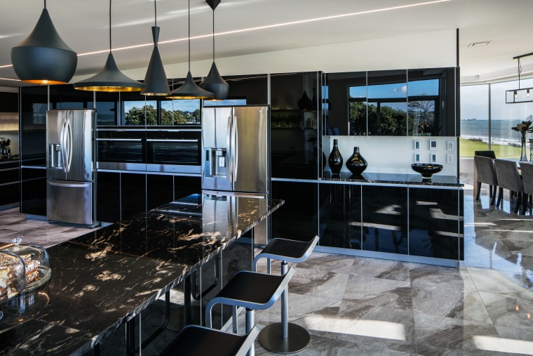 Designer Damian Hannah specified black German glass doors countertop, interior design, kitchen, gray, black