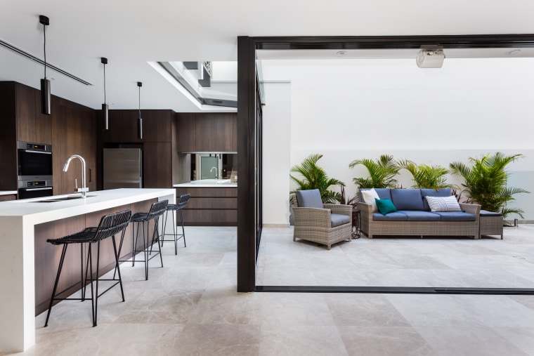 This clean-lined kitchen forms part of a whole-house floor, interior design, living room, white, gray
