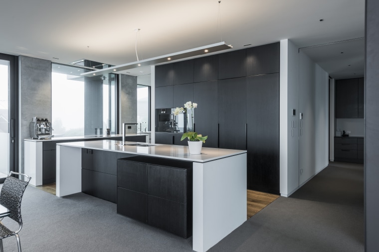 Bold and sculptural with no fussy detailing, this architecture, cabinetry, countertop, cuisine classique, interior design, kitchen, gray, black