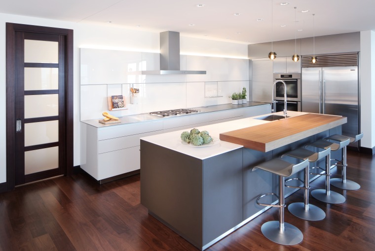 This entertainer’s kitchen by Kitchen Distributors includes a cabinetry, countertop, interior design, kitchen, white, timber floor,