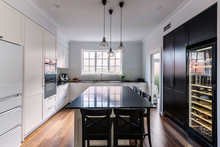 Black pantry on one side of this kitchen cabinetry, countertop, interior design, kitchen, designer kitchen, IL Design, black cabinetry, ceasarstone