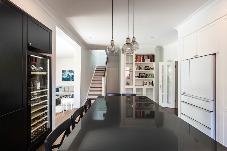 In this entertainer’s kitchen, the black pantry on interior design, white, black, kitchen, kitchen design, IL Kitchens, cabinetry,