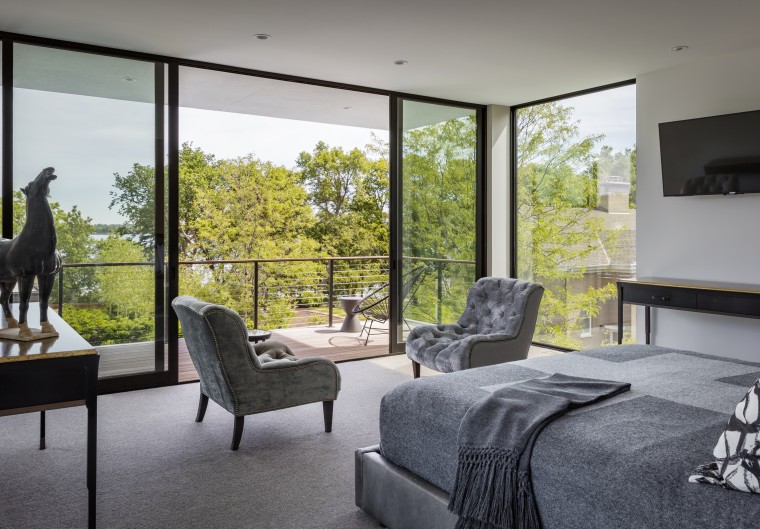 Having large sliding glass panels means the surrounding architecture, home, house, interior design, bedroom, window, gray, furnture