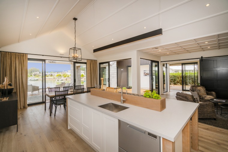 Open sesame. Covered pavilions straight ahead and to countertop, house, interior design, kitchen, Landmark Homes, Showhome, Coromandel, timber flooring