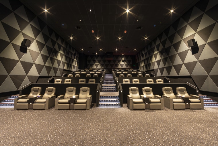 The EntX Entertainment Centre has quiet, warm cinemas auditorium, flooring, function hall, interior design, black, brown