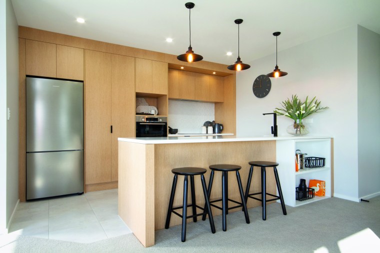 In this GJ Gardner Hamilton showhome, the modern architecture, cabinetry, countertop, benchtop, kitchen, home, house, interior design, GJ Gardner, showhome, cabinetry, timber