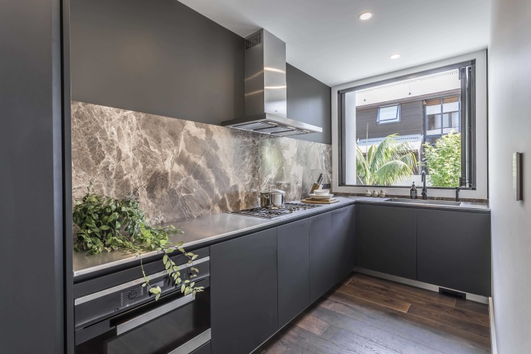 ​​​​​​​Stainless steel benchtops in this scullery provide a architecture, scullery, cabinetry, countertop, benchtop, stainless steel, marble, splashback, Studio Italia
