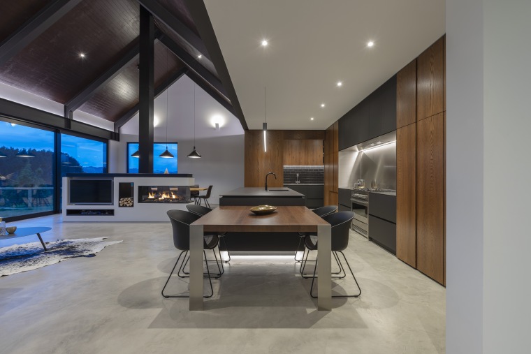 While this kitchen needed to tie in with apartment, architecture, building, ceiling, design, cabinetry, kitchen, dining room, floor, flooring, furniture, home, house, interior design, lighting, living room, loft, property, real estate, room, table, wall, gray