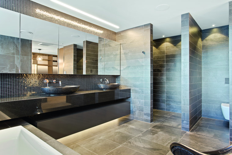 ​​​​​​​This atmospheric master ensuite includes the dark, shimmery architecture, master suite, bathroom, floor, flooring, furniture, glass, home, house, interior design, tile, wall, white, concealed lighting, glass mosaics, O'Neil Architecture
