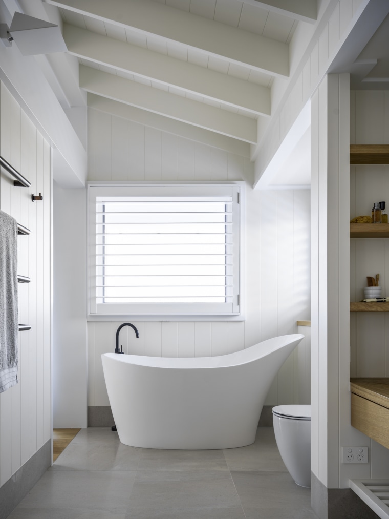 The aptly named slipper bath provides a focal architecture, bathroom, bathtub, building, ceiling, daylighting, floor, flooring, furniture, home, house, interior design, plumbing fixture, property, room, tile, toilet, white, gray, white