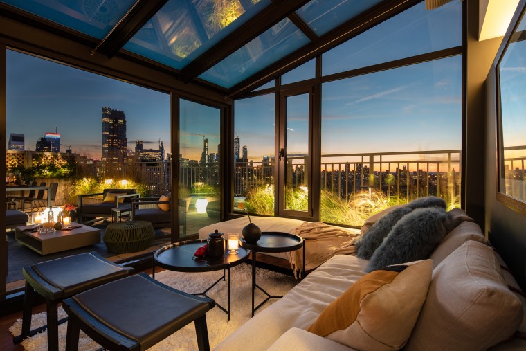 A major attraction when the owner bought this apartment, architecture, building, condominium, estate, furniture, home, house, interior design, lighting, living room, patio, property, real estate, resort, roof, room, sky, black