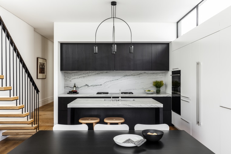 A modern kitchen in a modest-sized home, this white