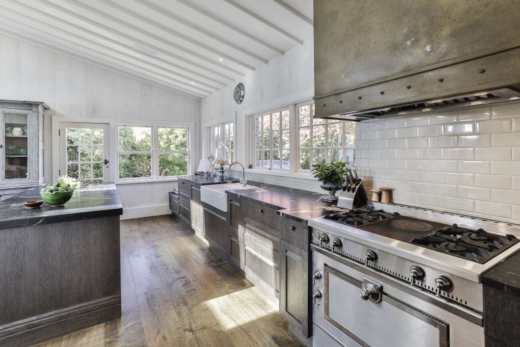 This kitchen’s darker tones make perfect sense within gray