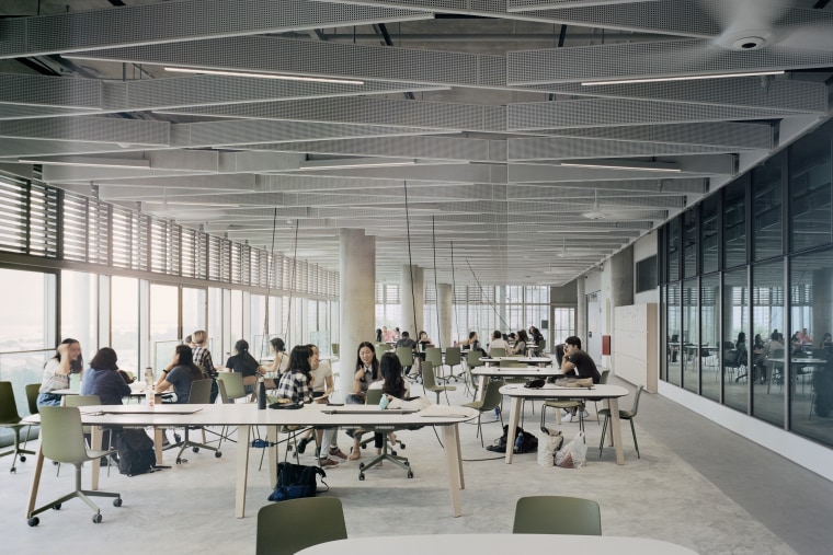 The modern SDE4 building draws on classic architectural architecture, building, ceiling, design, furniture, interior design, office, room, table, gray