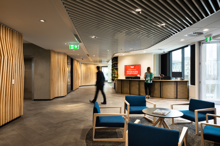 Westpac’s head office reception area in the new architecture, building, ceiling, design, floor, flooring, furniture, interior design, lobby, office, room, table, wall, brown, reception