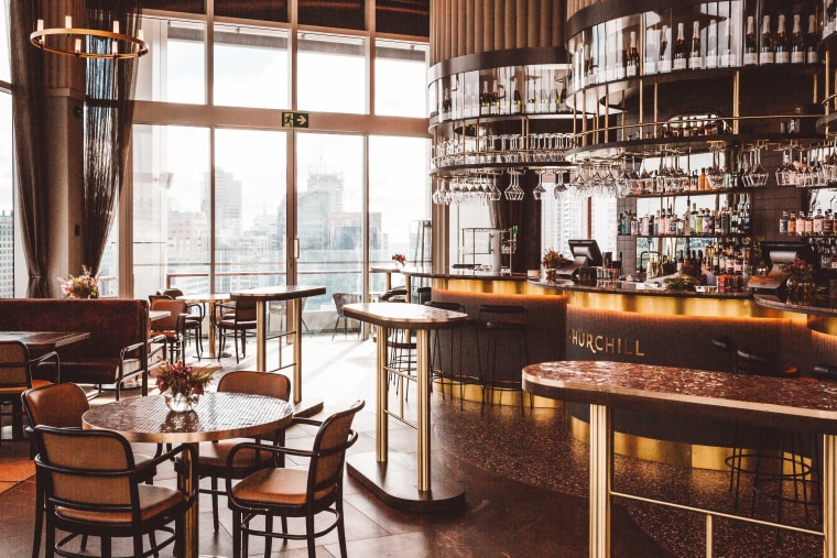 Pride of place – The Churchill occupies part architecture, bar, building, coffeehouse, furniture, interior design, restaurant, room, table, black, white