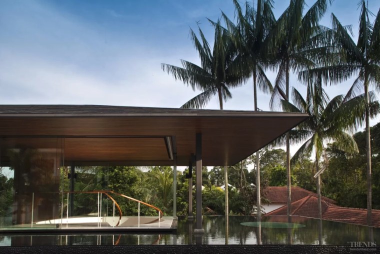 The living pavilion resembles a floating platform. Glass architecture, arecales, building, eco hotel, estate, facade, home, house, leisure, palm tree, property, real estate, resort, roof, shade, tree, vacation, villa, black
