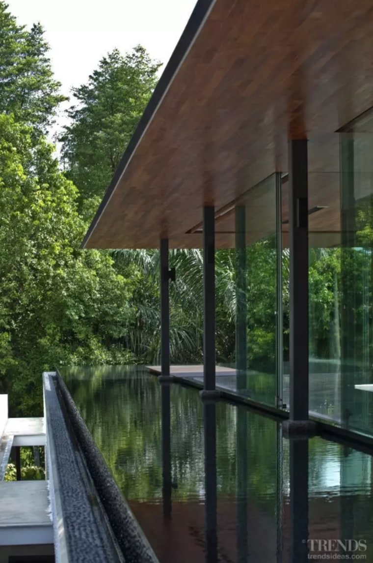 Ripples on the water enliven the interior spaces. architecture, building, cottage, home, house, pavilion, porch, property, real estate, room, shade, tree, window, black, green