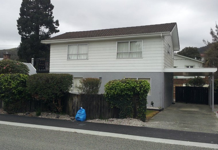 Before renovation: the house was previously divided into architecture, building, cottage, facade, home, house, neighbourhood, property, real estate, residential area, roof, black, gray