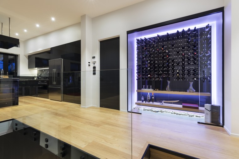 The wine cellar has a concealed glass sliding flooring, interior design, gray
