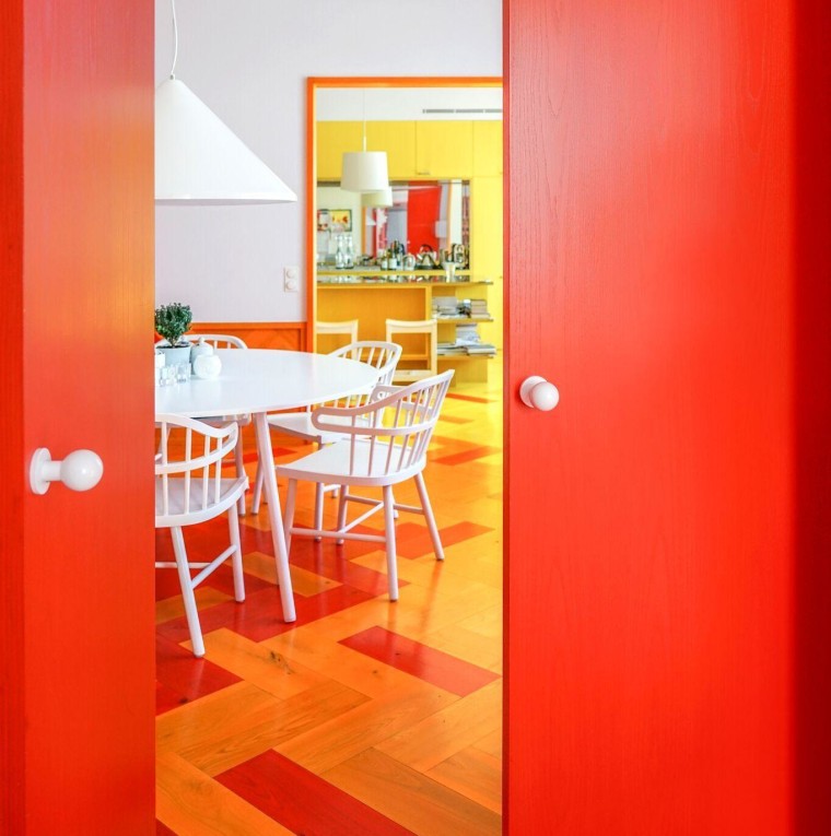 “The colours are addictive. Now that we know architecture, building, door, floor, furniture, house, interior design, line, material property, orange, property, red, room, table, wall, yellow, red, orange