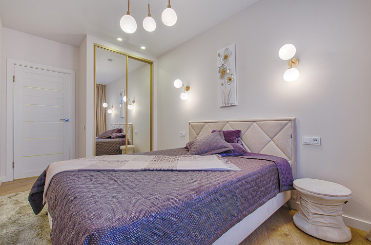 A floor length mirror hung vertically is not architecture, bed, bed frame, bed sheet, bedding, bedroom, building, ceiling, duvet cover, floor, furniture, hardwood, home, house, interior design, mattress, mattress pad, nightstand, property, purple, real estate, room, wall, gray