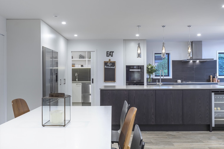In this sleek kitchen project by designer Kira countertop, kitchen design, kitchen, Kira Gray, Fyfe Kitchens, concrete benchtop