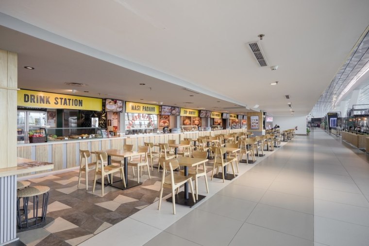 Terminal 3 responds to the needs of passengers food court, mixed use, shopping mall, gray