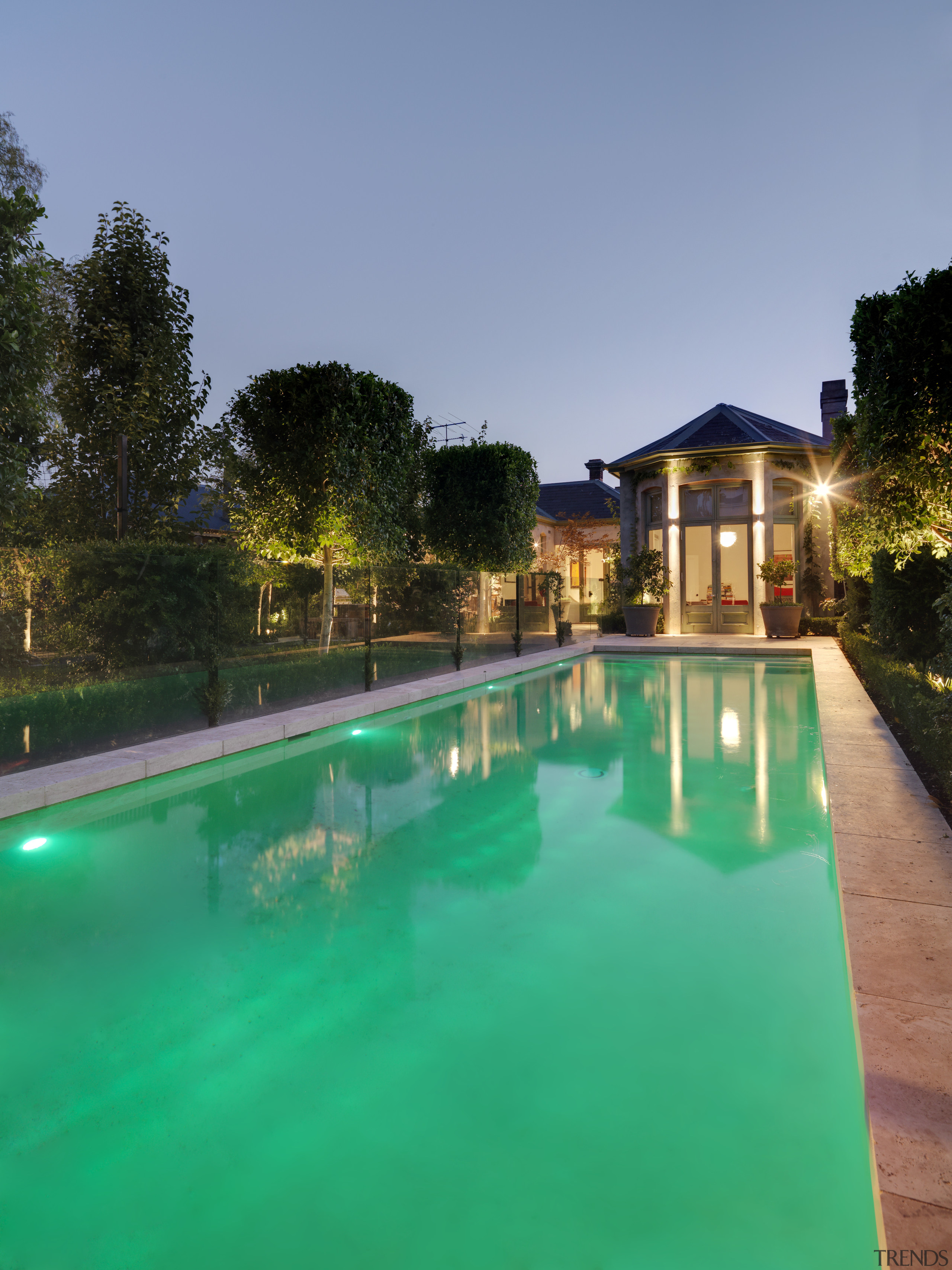 View of the pool which is surrounded by estate, grass, hacienda, leisure, lighting, plant, property, real estate, reflection, resort, sky, swimming pool, villa, water, teal