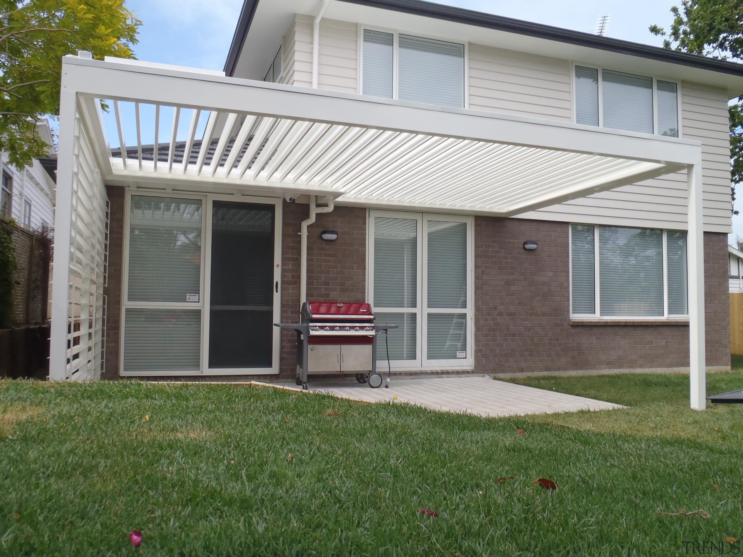 Our beautifully designed 200mm blades look great and backyard, facade, home, house, outdoor structure, porch, property, real estate, residential area, roof, siding, window, yard, gray