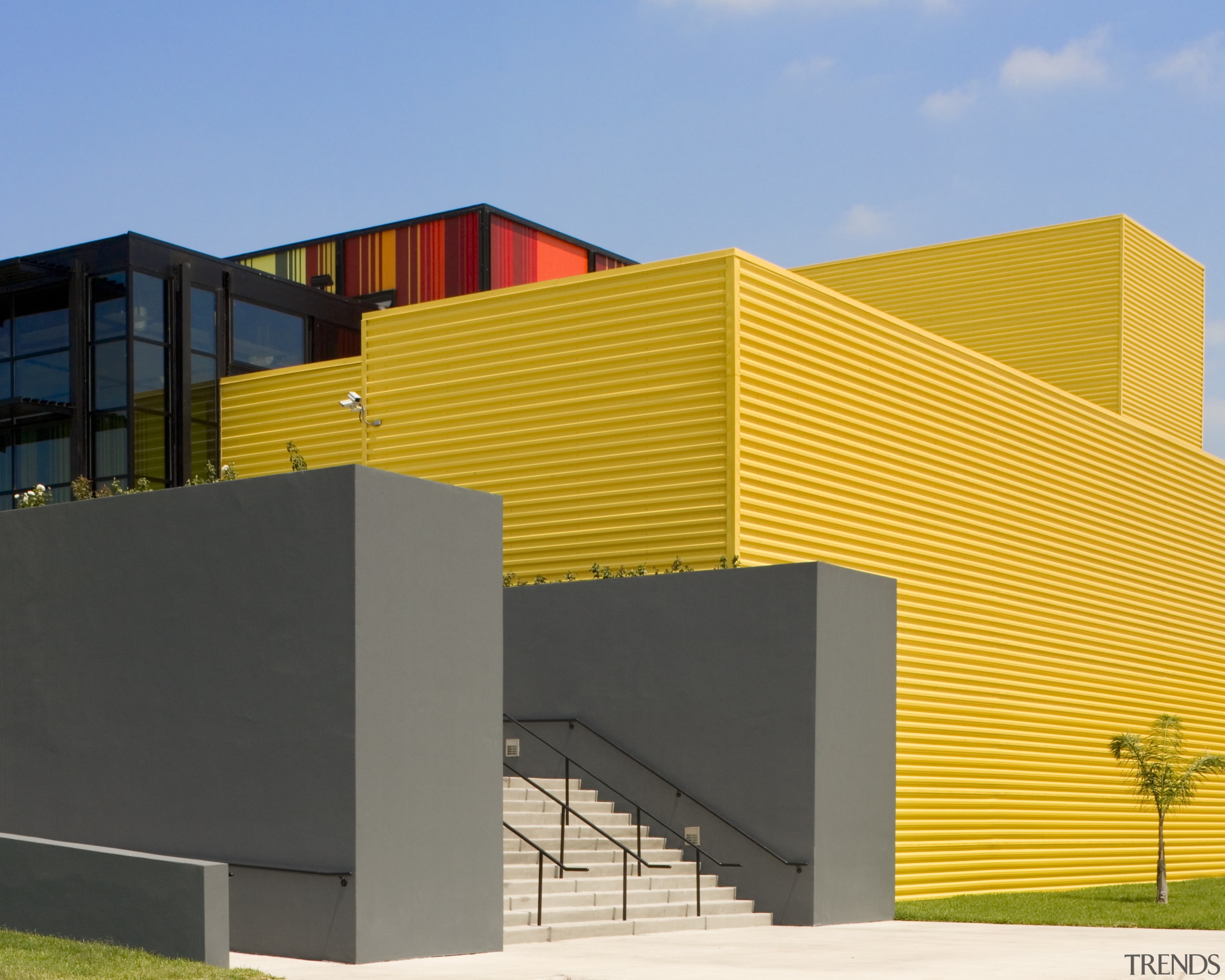 Exterior view of the Edcouch-Elsa Fine Arts Centre architecture, building, commercial building, corporate headquarters, elevation, facade, home, house, line, real estate, residential area, sky, structure, orange