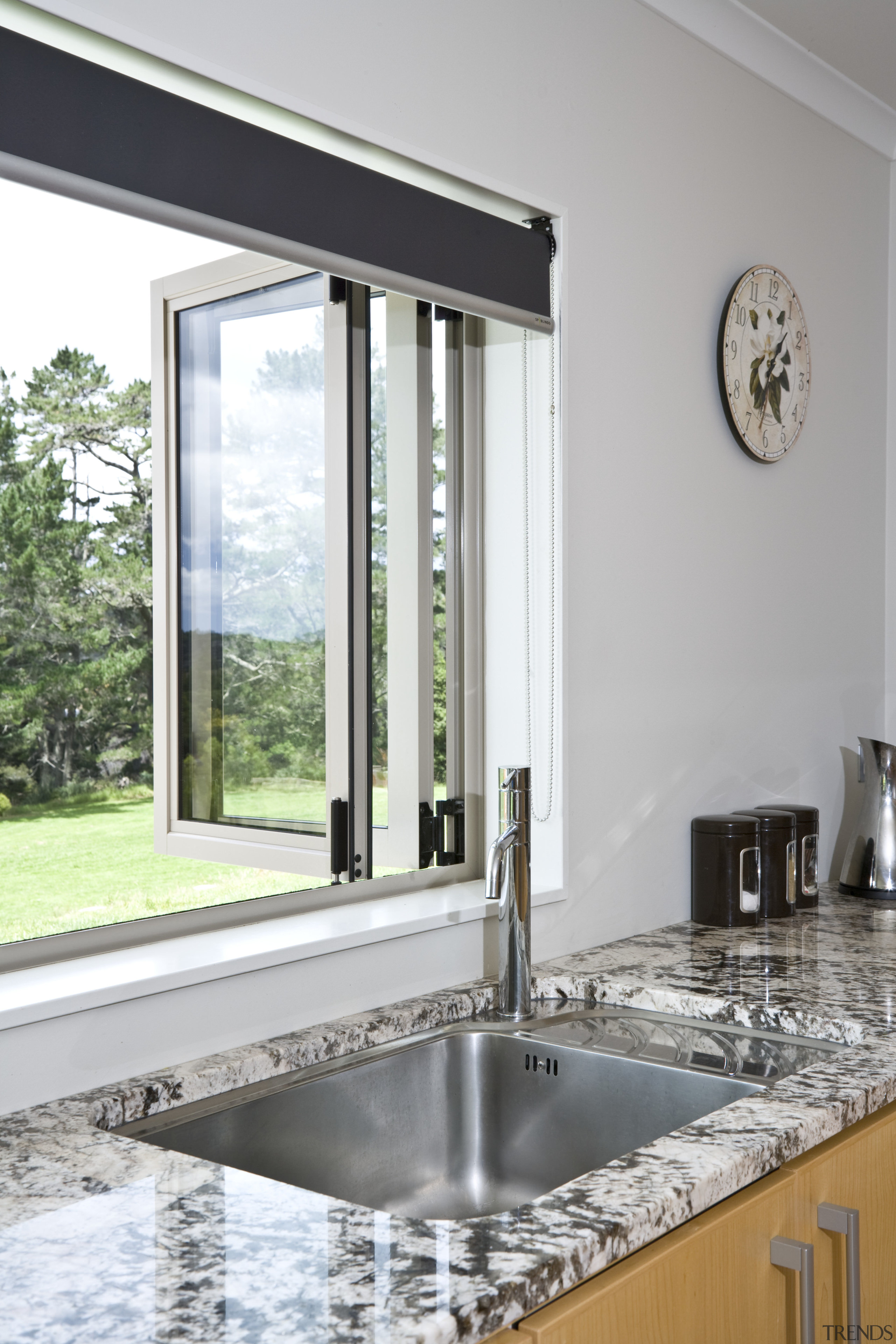 View of a kitchen designed and manufactured by countertop, interior design, sink, tap, window, gray