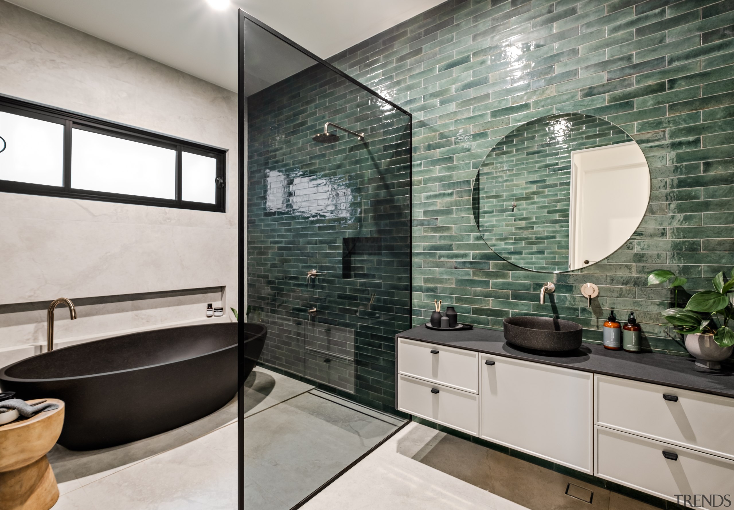 The main bathroom complete with green tilework and 