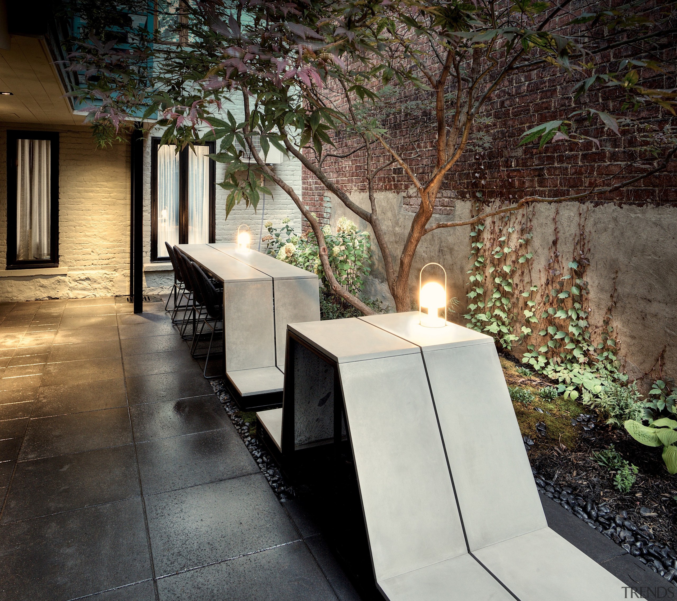 LED lanterns placed here and there light the architecture, backyard, building, concrete, design, floor, flooring, furniture, home, house, interior design, landscape lighting, landscaping, lighting, material property, property, room, table, tree, wall, black, gray