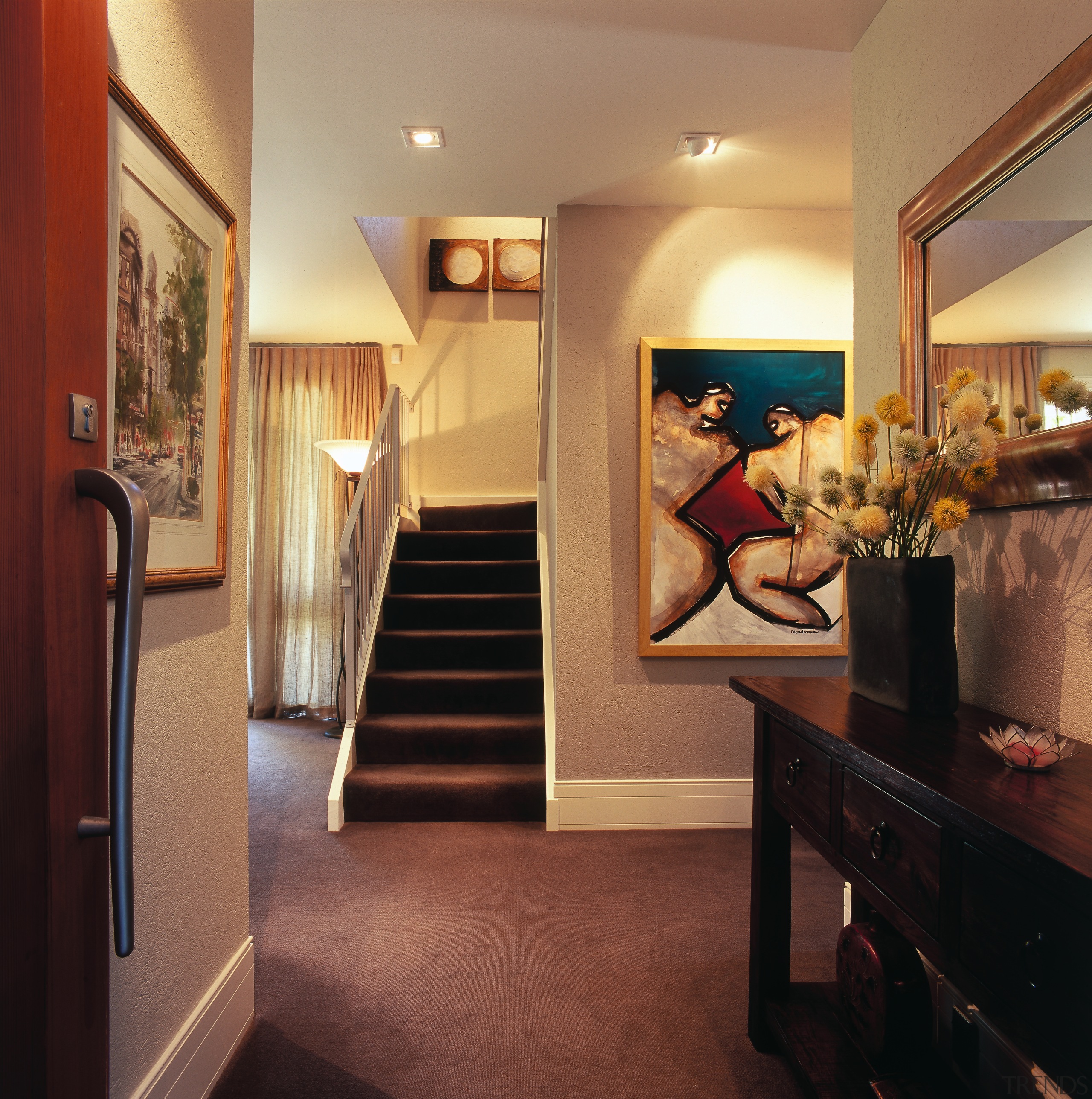 A view of the hallway and stairway, brown ceiling, floor, flooring, home, interior design, real estate, room, suite, brown, orange, black