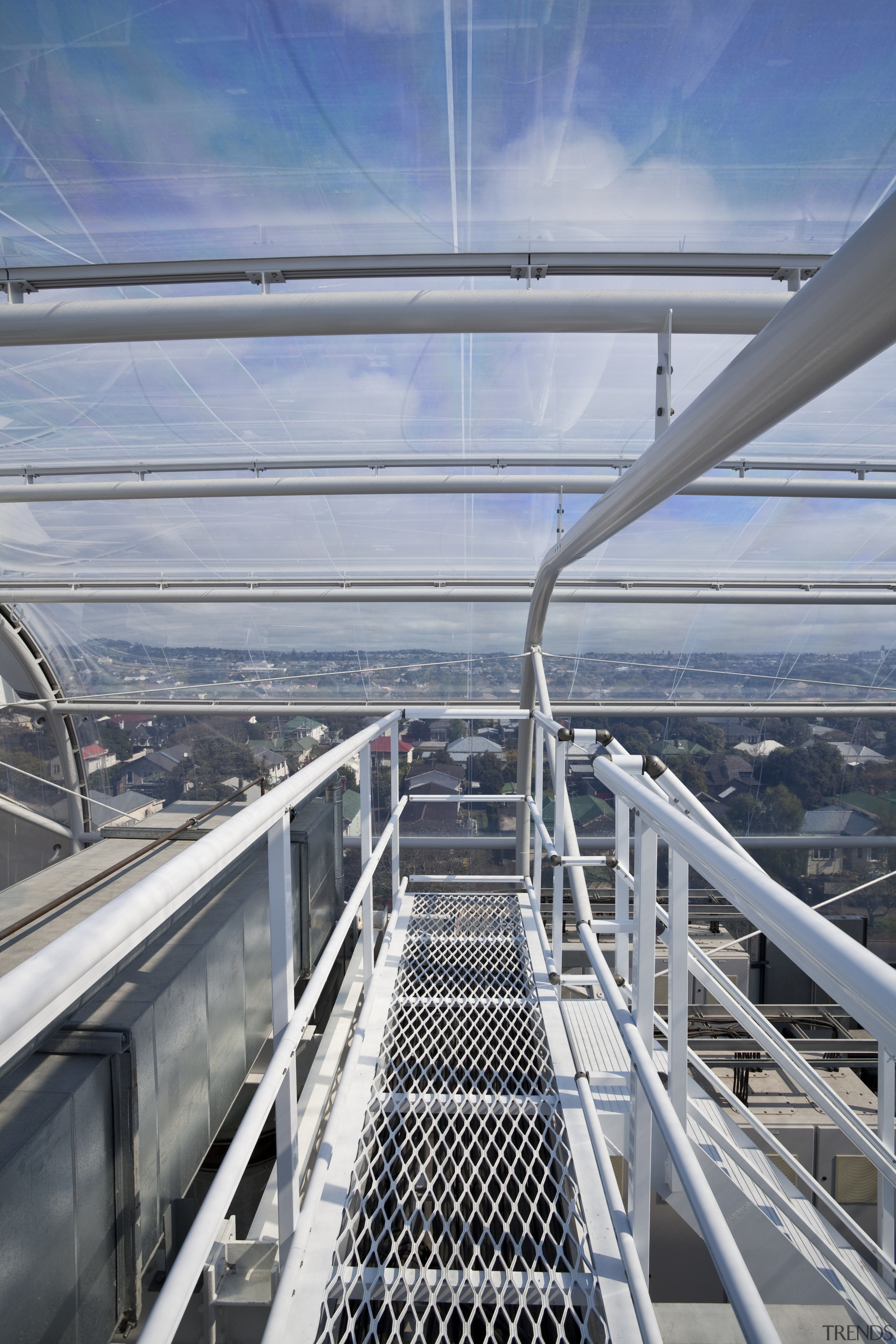 View of the roof of the south stand building, deck, fixed link, sky, skyway, water, gray