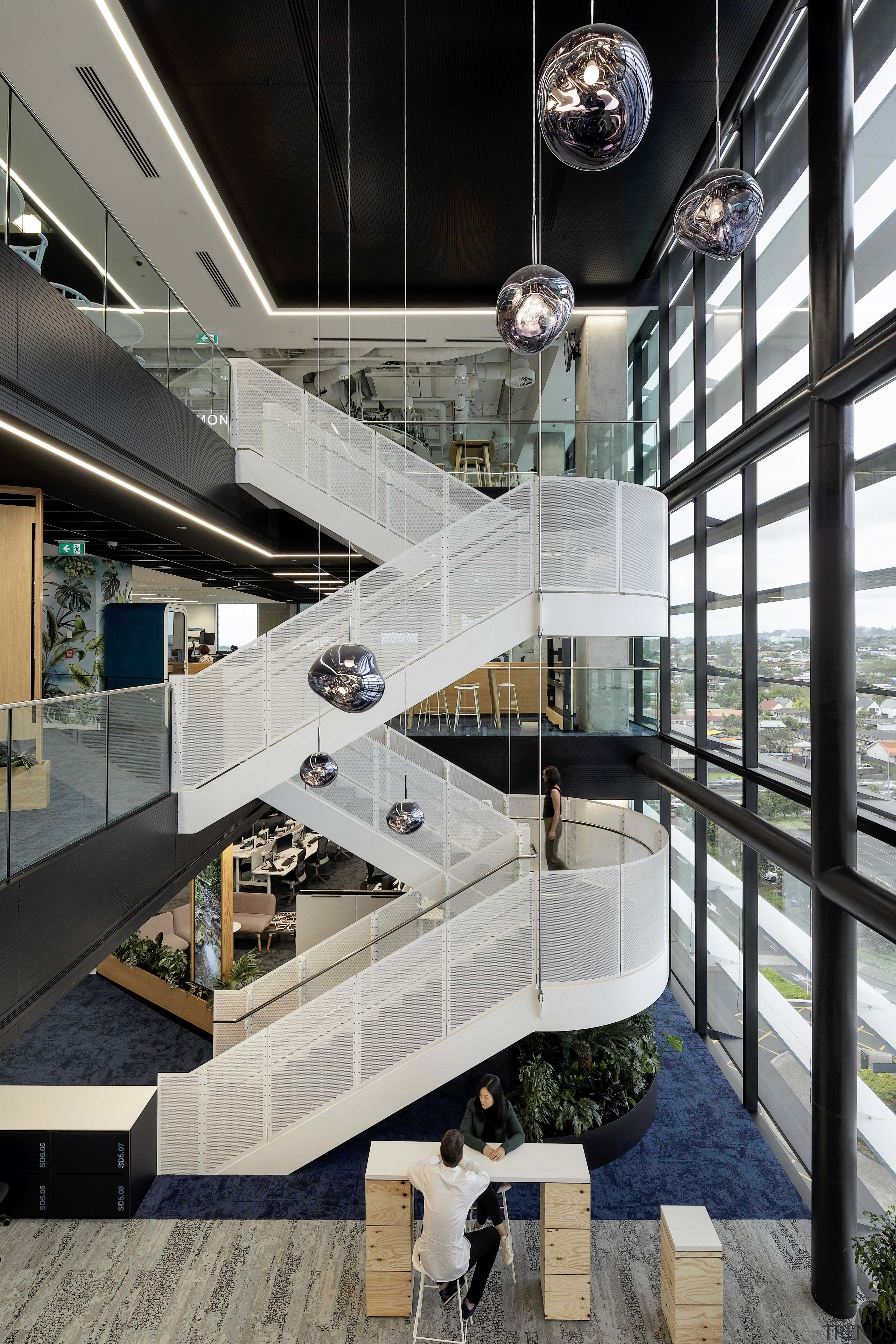The dramatic ANZ Raranga base building stair is black, gray