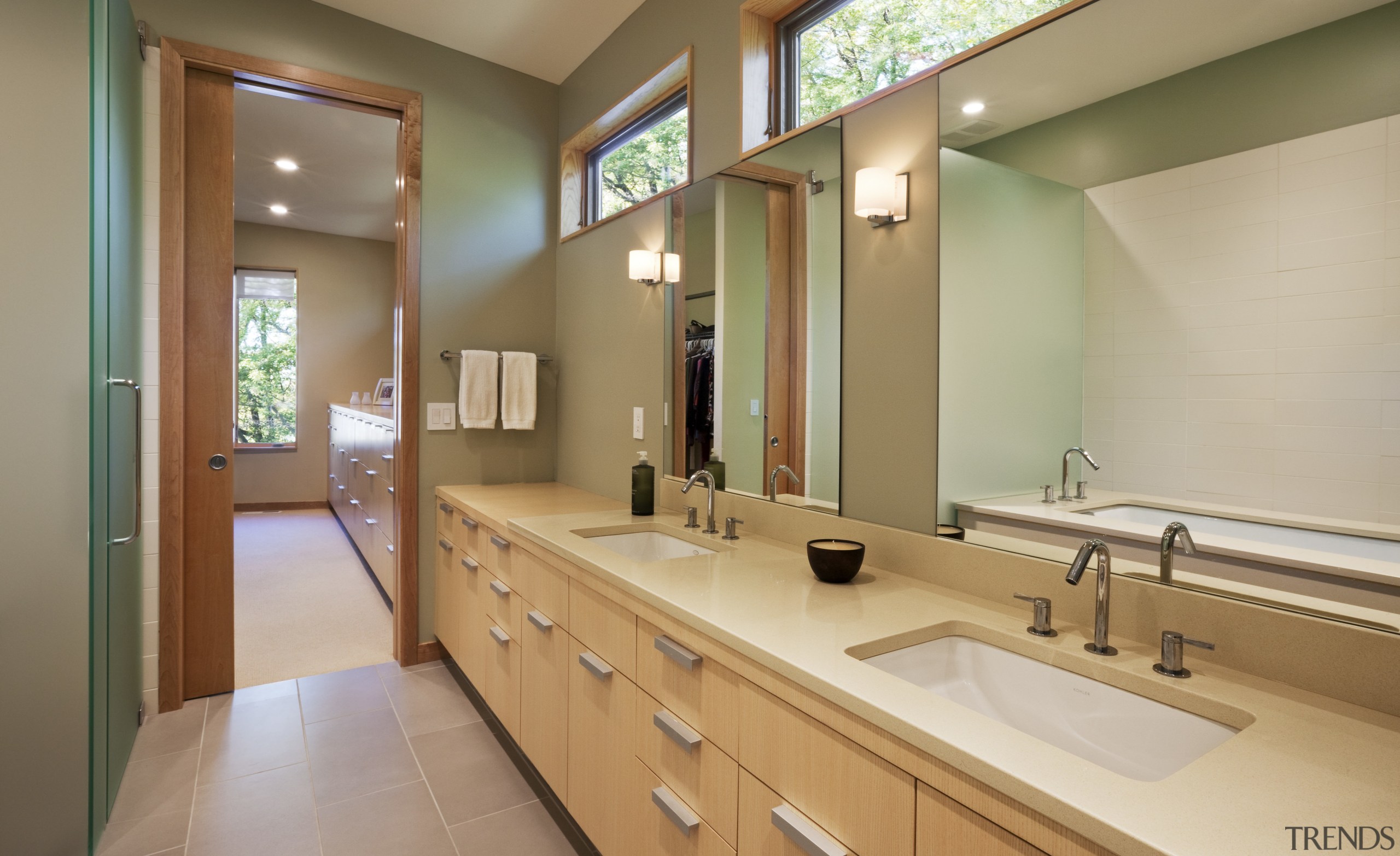 View of the master bathroom featuring wood cabinetry, bathroom, countertop, estate, home, interior design, property, real estate, room, brown, gray