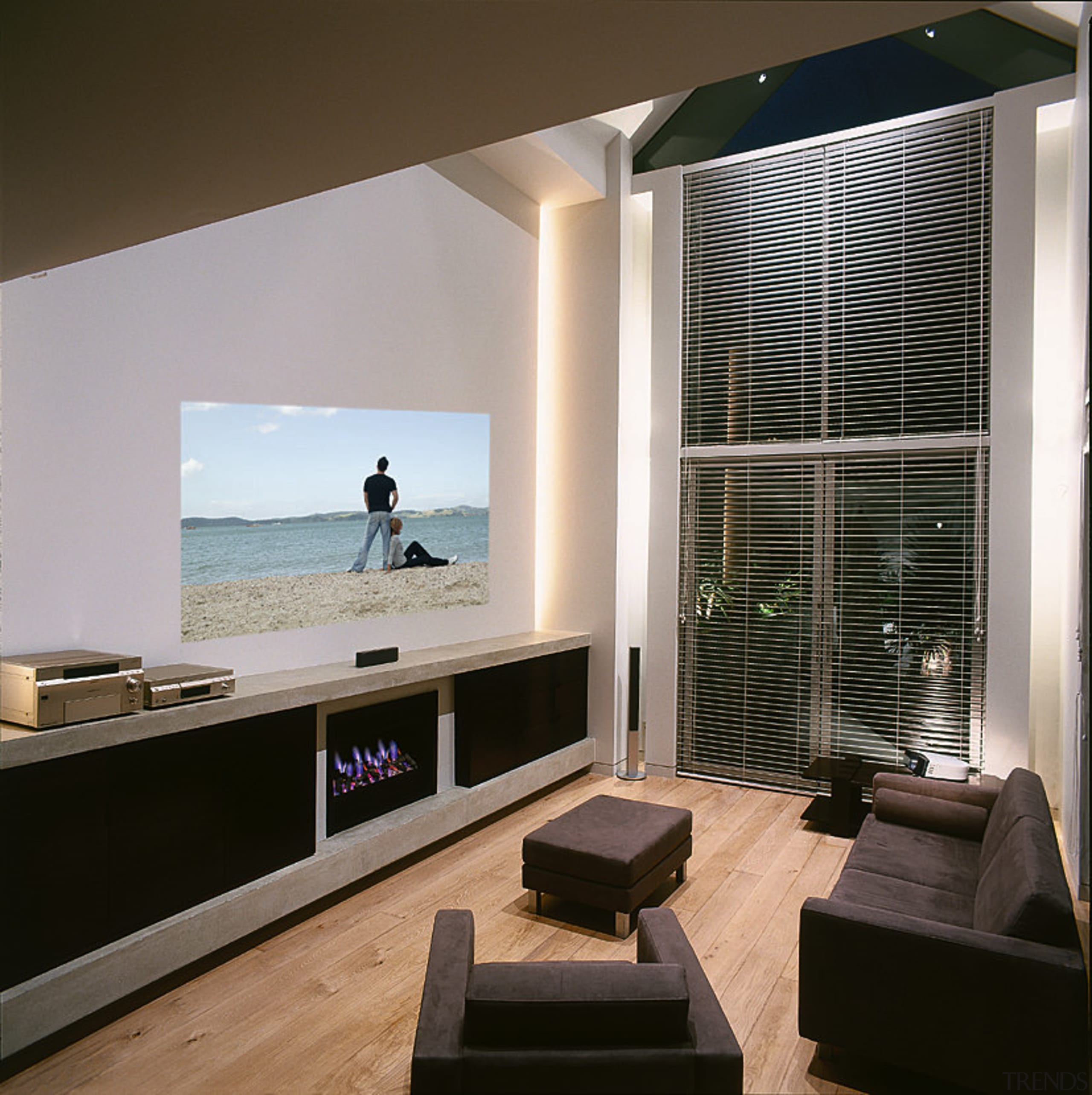 A photograph of a family room featuring a furniture, interior design, living room, room, window, black, gray