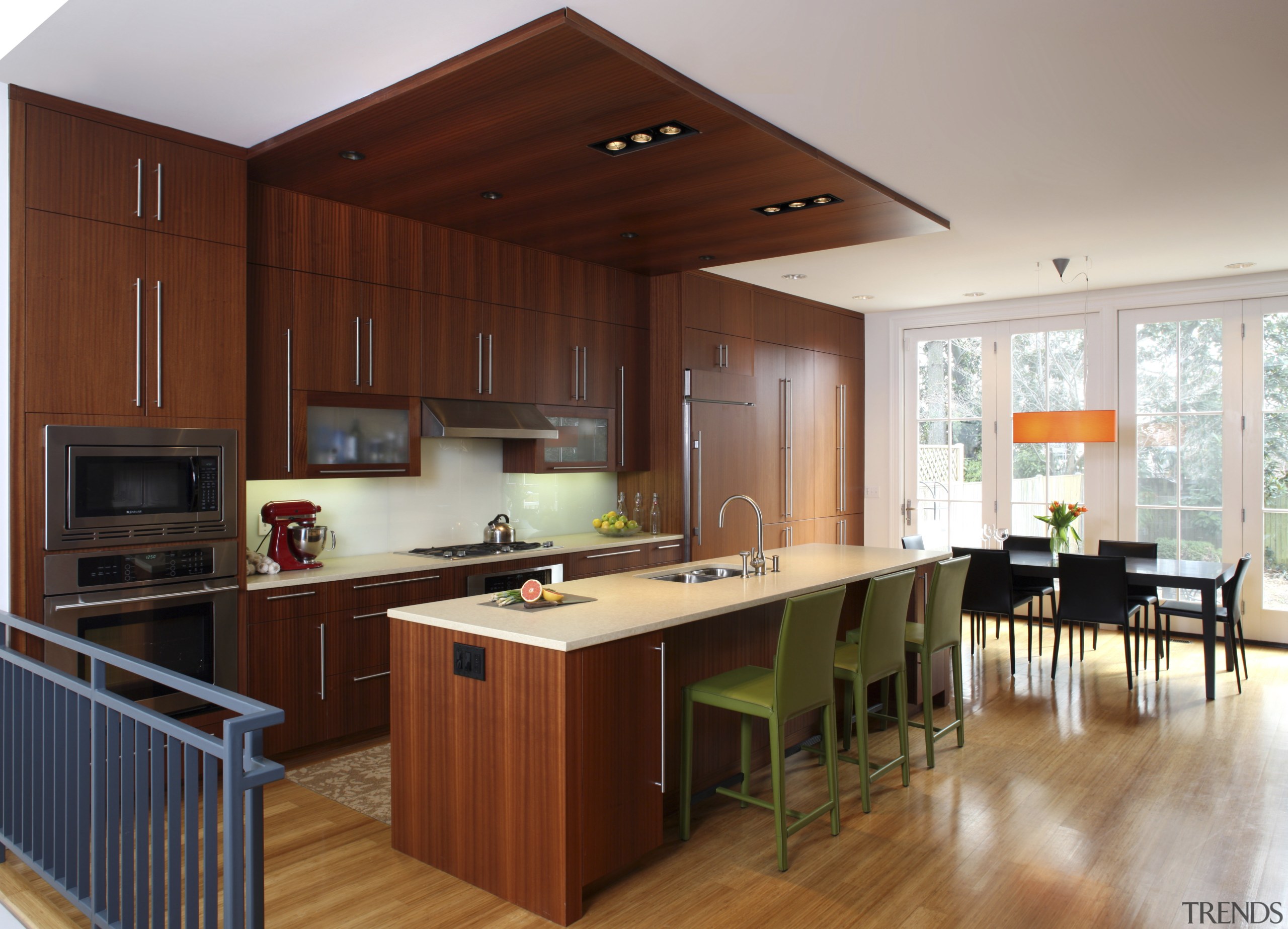 View of a kitchen which features a kitchen cabinetry, countertop, cuisine classique, floor, flooring, hardwood, interior design, kitchen, real estate, room, wood, wood flooring, gray, brown