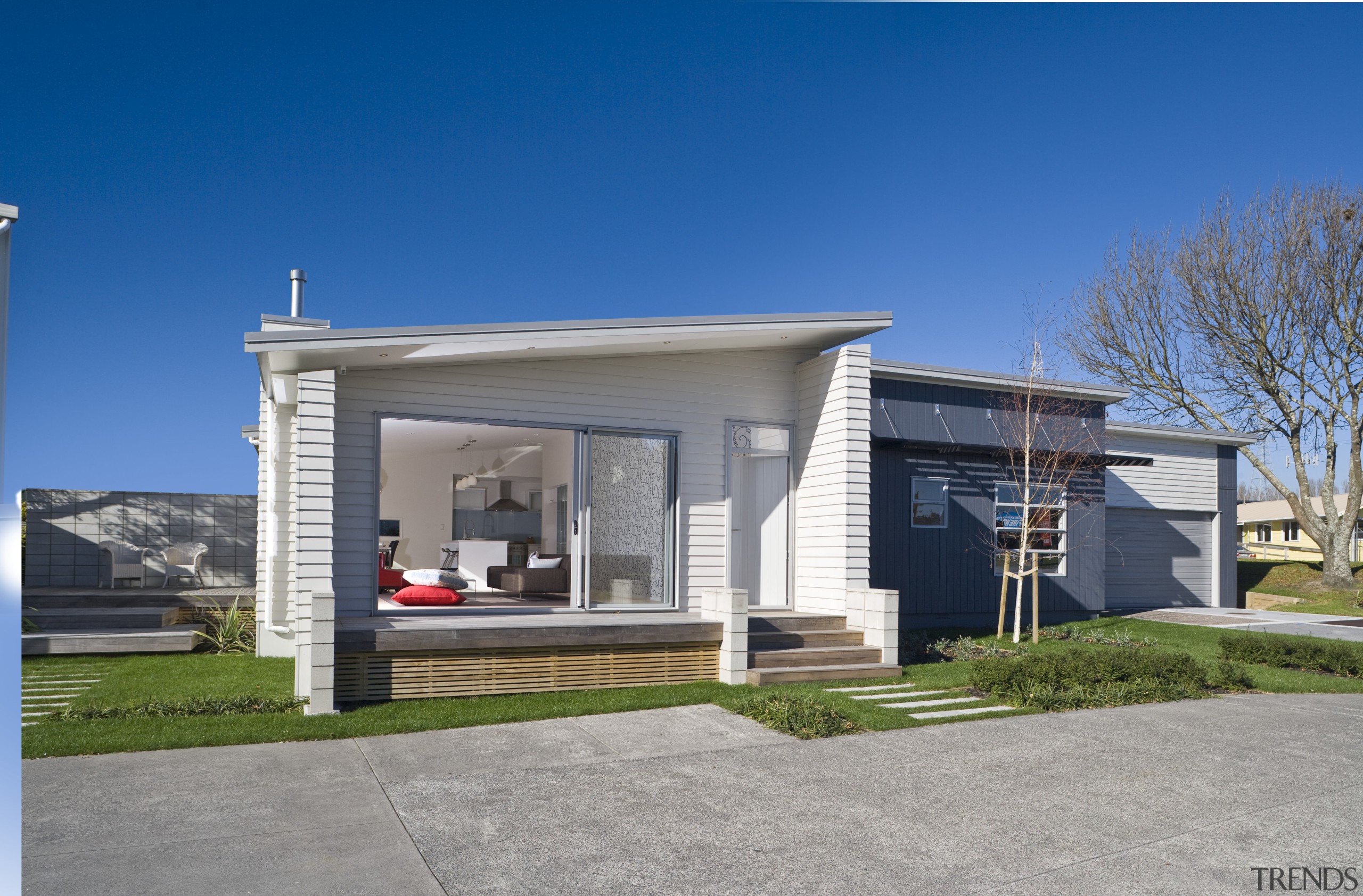 Exterior view of a Harmony Homes show home building, elevation, estate, facade, home, house, property, real estate, residential area, gray, blue