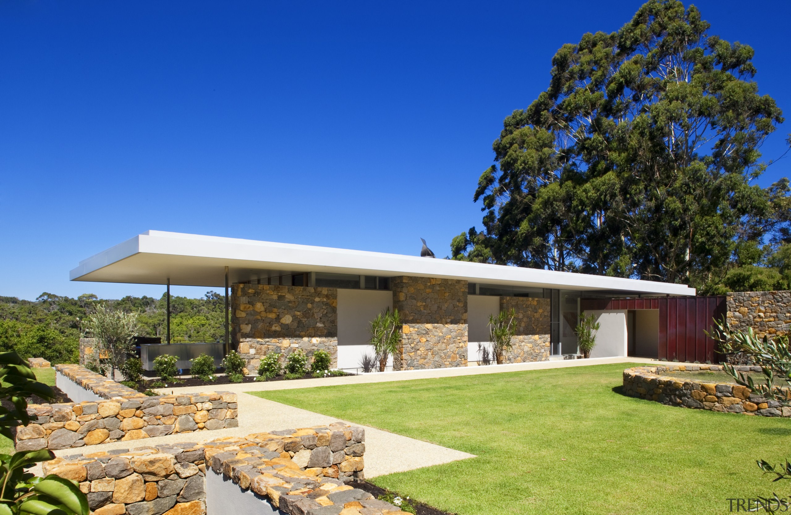 This house was designed by Tim Wright AIA architecture, cottage, elevation, estate, facade, home, house, landscape, property, real estate, roof, sky, villa, yard, blue