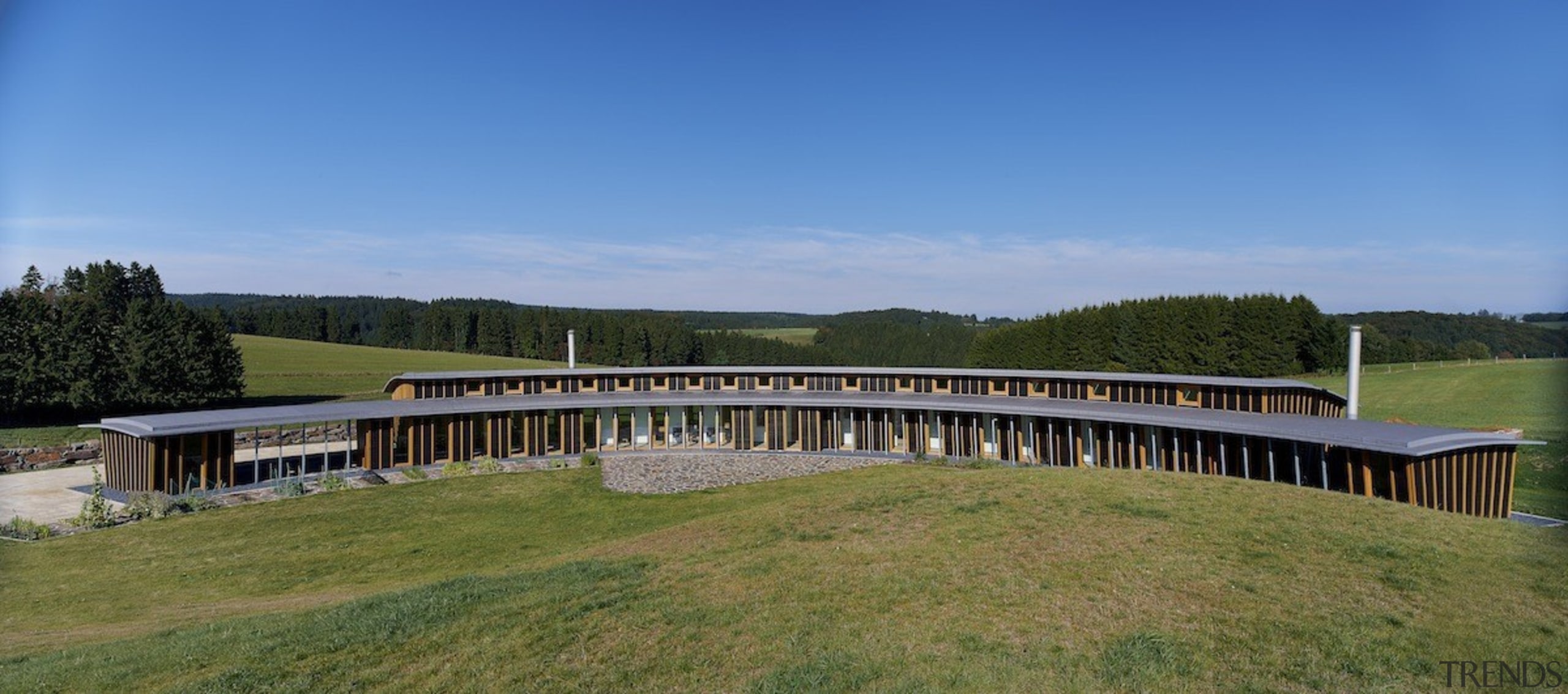 With sustainability and passive design rising high in bridge, grass, property, real estate, sky, teal, brown