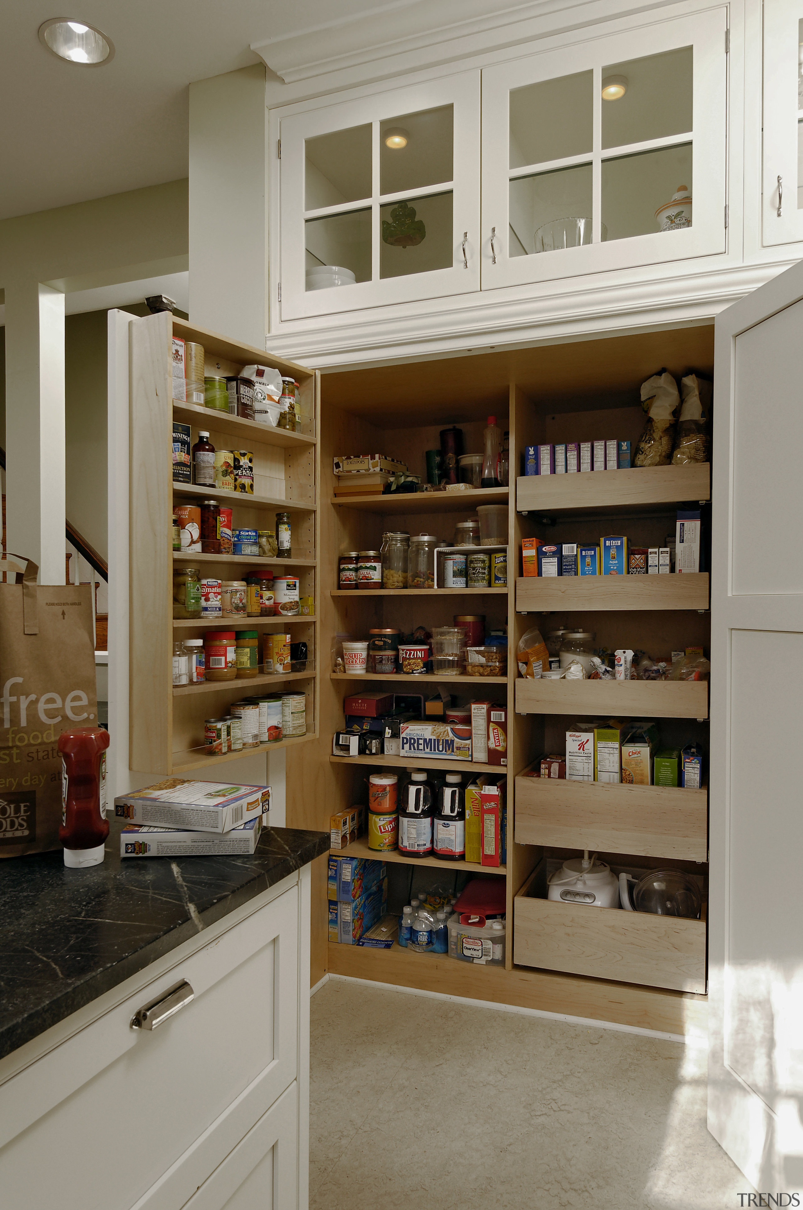 View of kitchen designed by Jennifer Gilmer Kitchen bookcase, cabinetry, food storage, home accessories, kitchen, pantry, shelf, shelving, gray, brown