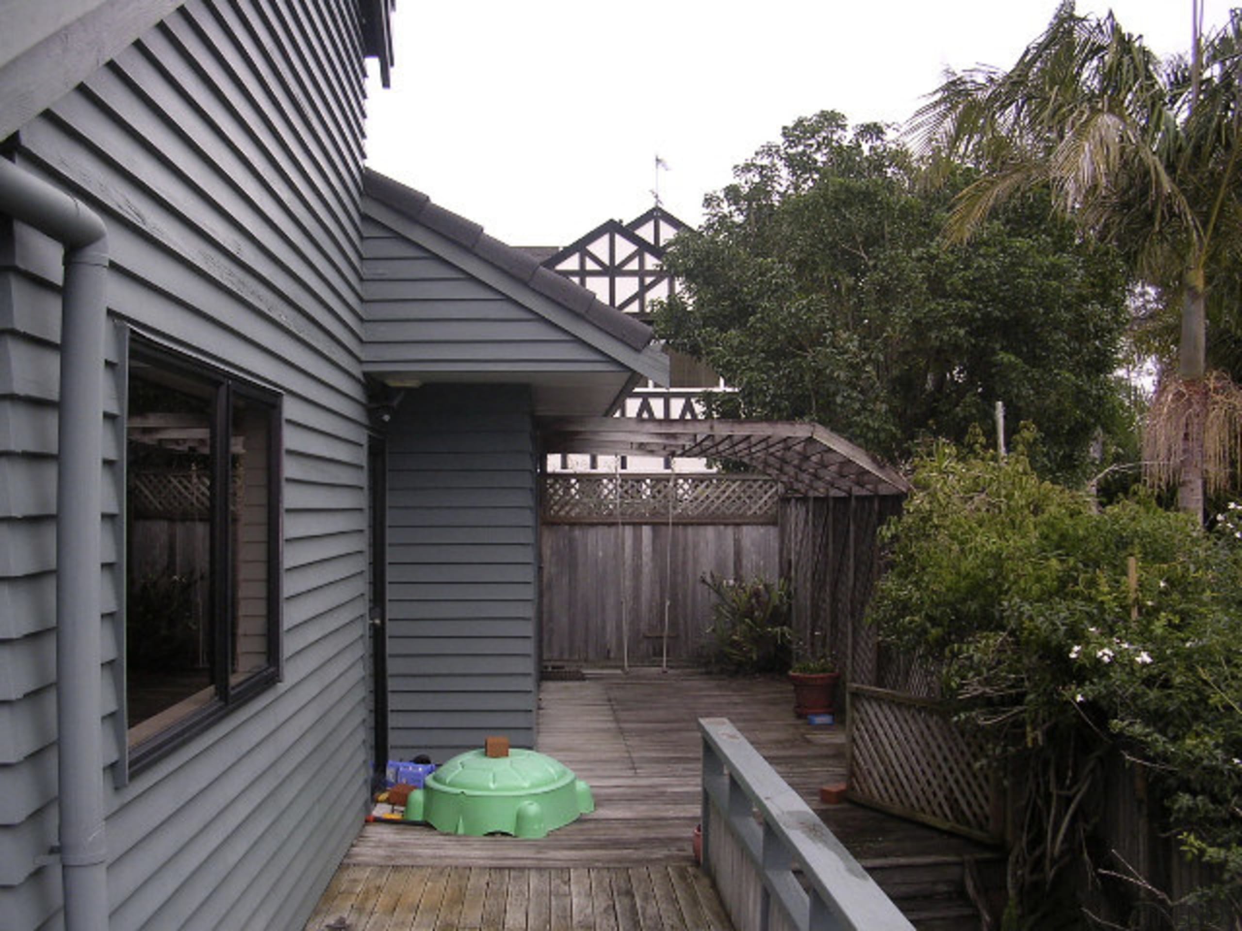 Exterior view of home prior to renovations. - backyard, cottage, home, house, outdoor structure, property, real estate, residential area, roof, shed, siding, walkway, yard, black, gray