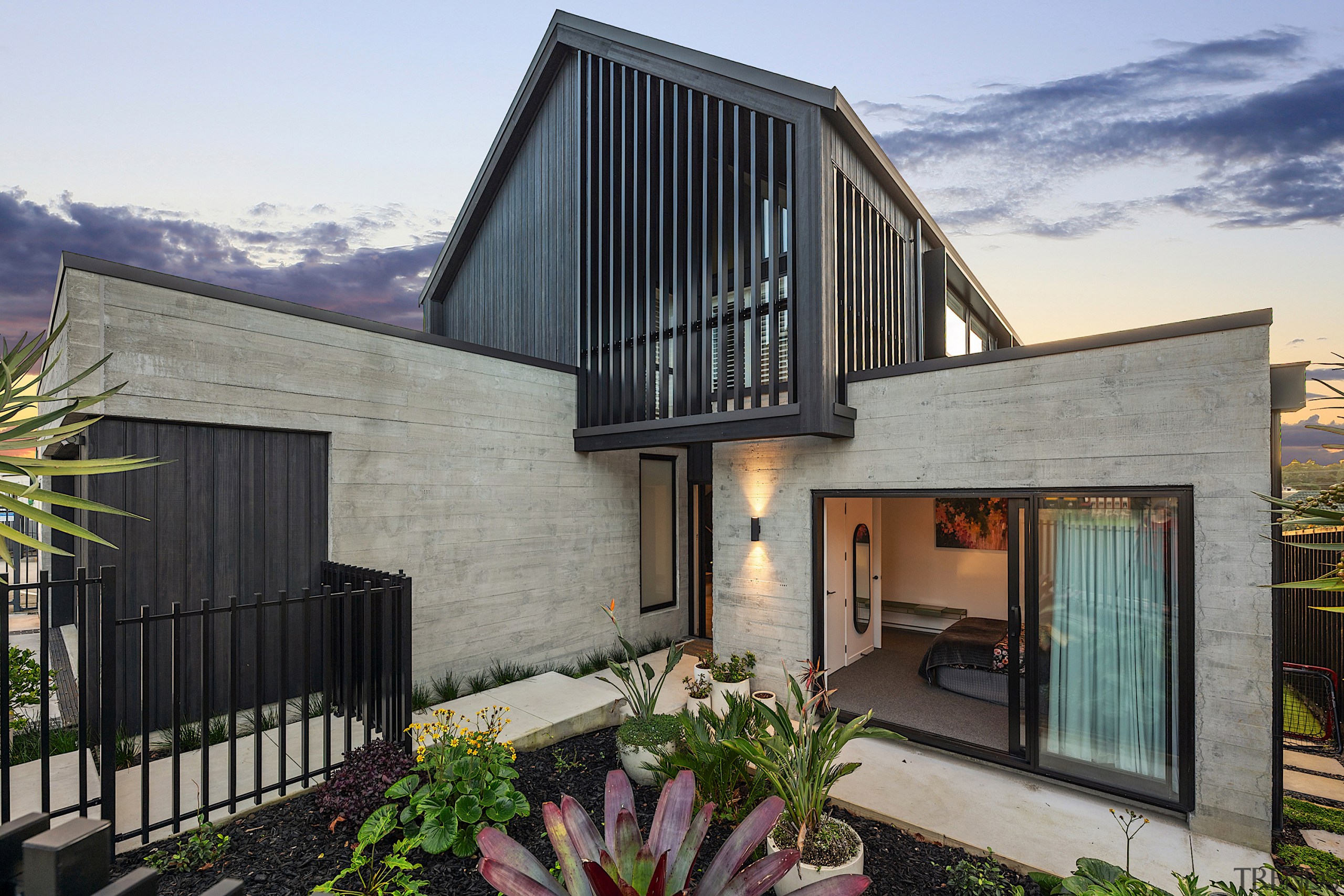Front garden view showing off the concrete meets 