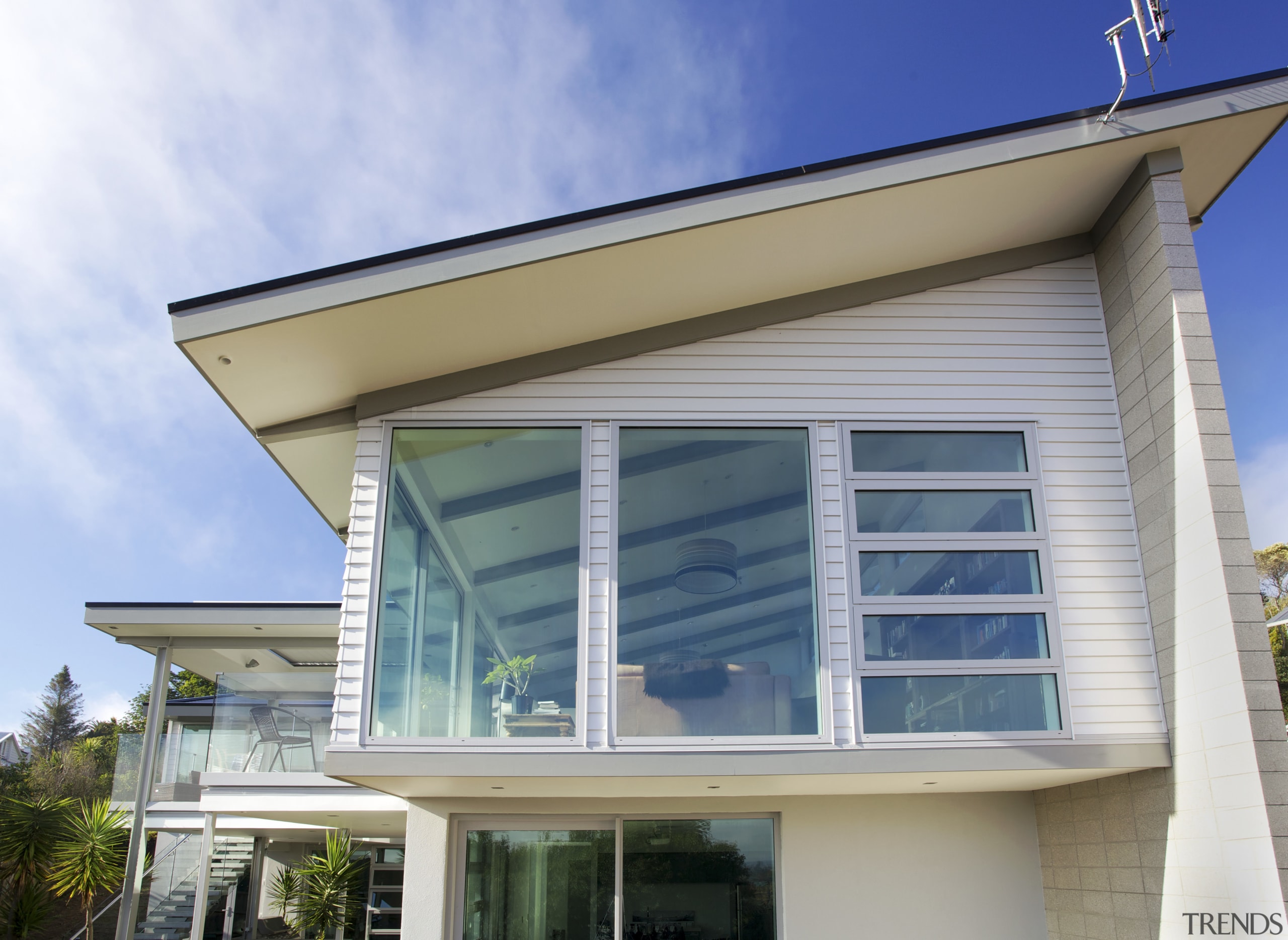 The Palliside weatherboard cladding system provides a clean, architecture, building, facade, home, house, real estate, roof, siding, window, white, gray