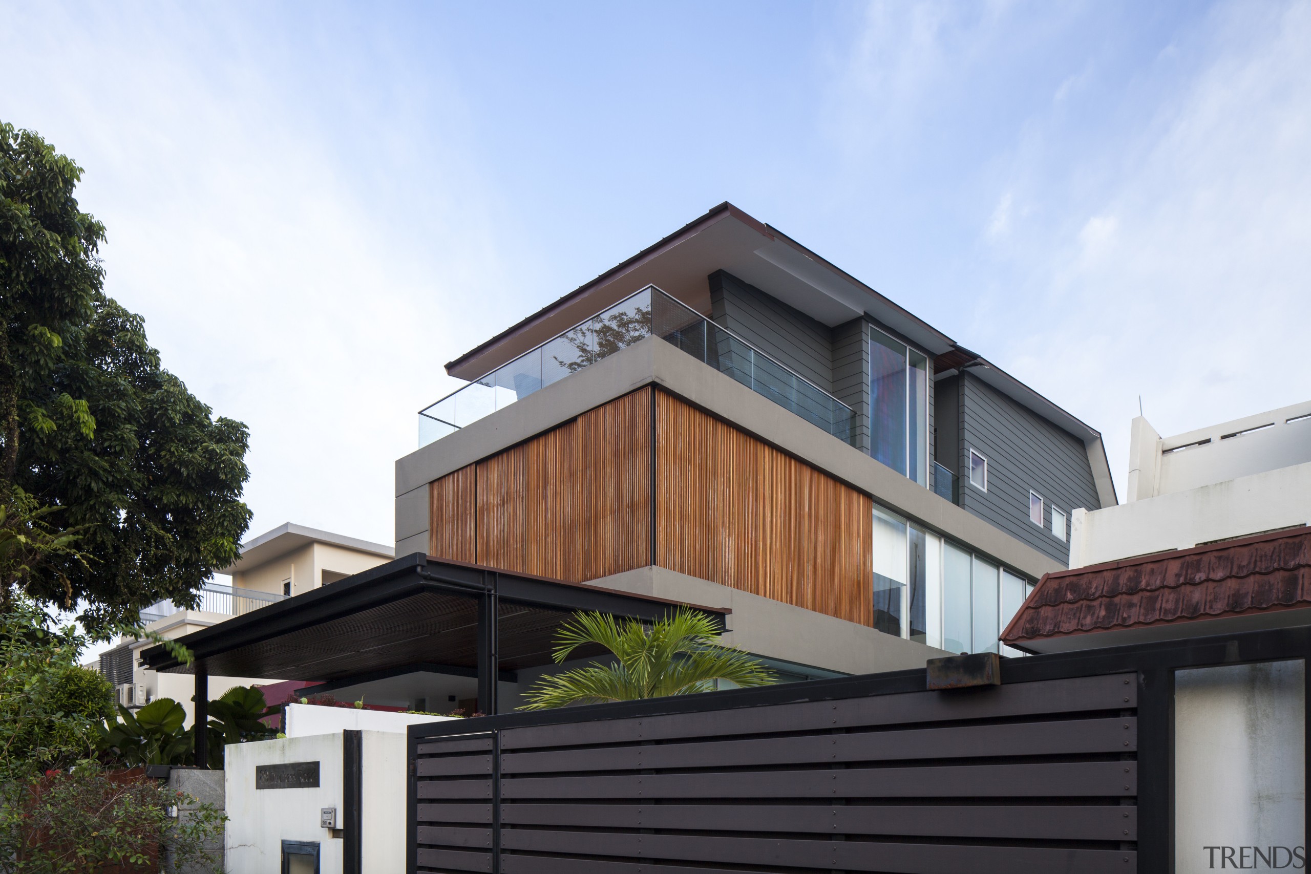 This 1990s house was extensively remodelled by the architecture, building, elevation, facade, home, house, property, real estate, residential area, roof, siding, white, black